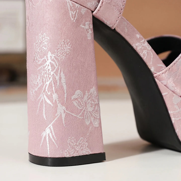 Fashionable women's platform sandals with chunky block heel. Elegant dress sandals for comfortable summer wear.