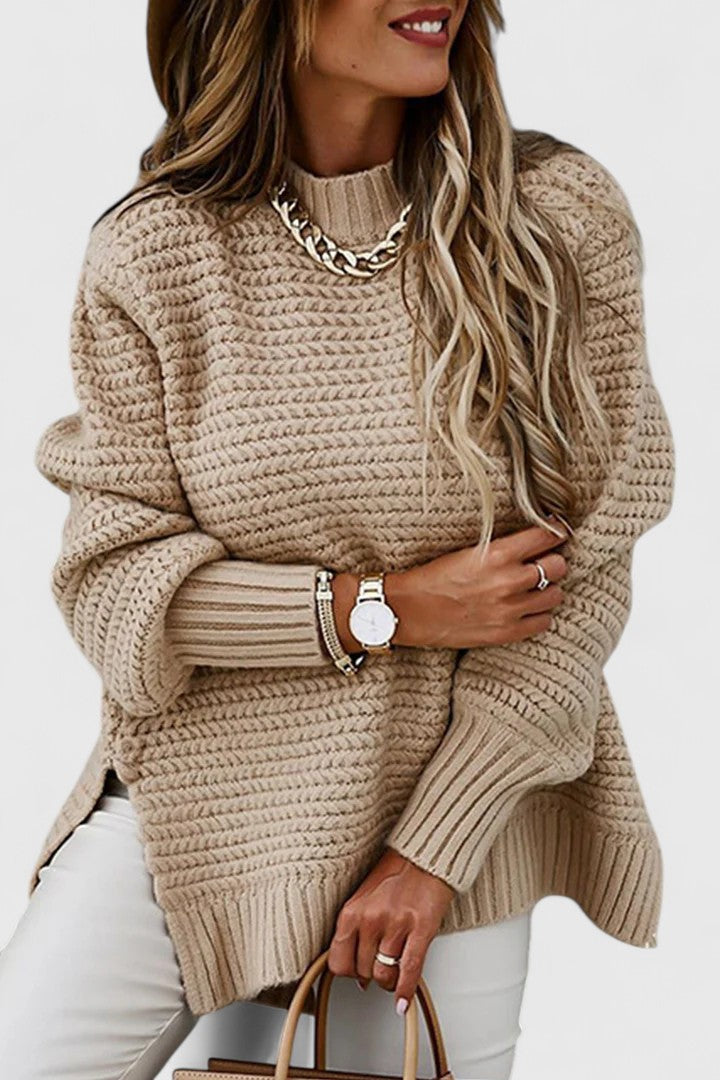Comfortable women's mock neck sweater featuring chunky ribbing, dropped shoulders & relaxed fit.