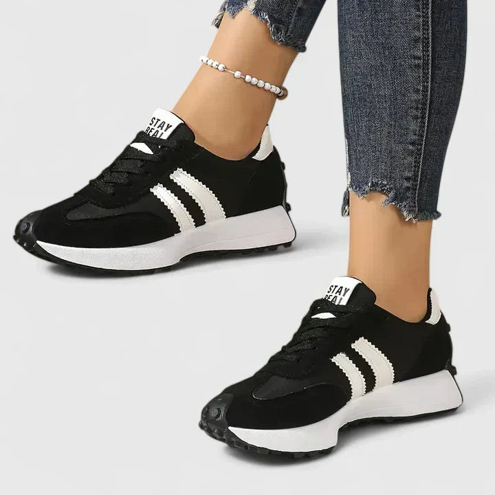 Women's chunky sole running shoes for gym workouts. Stylish lace-up athletic footwear for active women.