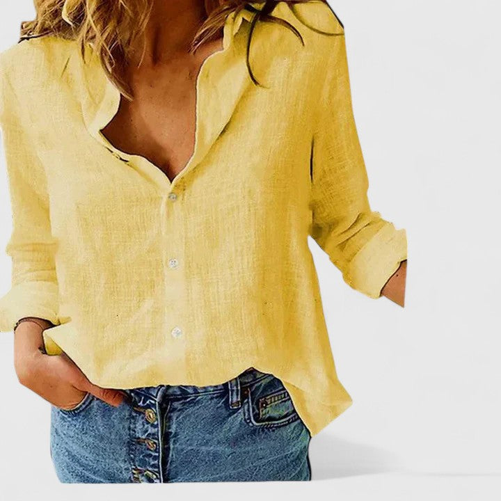 Comfortable women's button-down blouse with soft lapel, a relaxed fit for all-day casual or office wear.