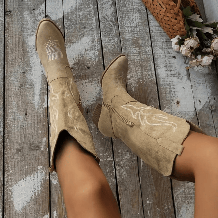 Women's classic cowboy boots with pointed toe, block heel & intricate embroidery. Easy side zipper for comfort.