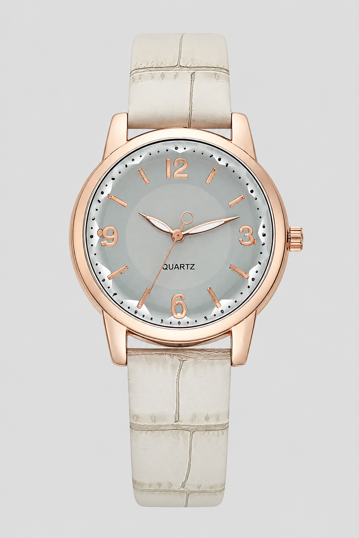 Classic ladies' quartz watch, minimalist dial, and a stylish embossed strap for an elegant wrist statement.