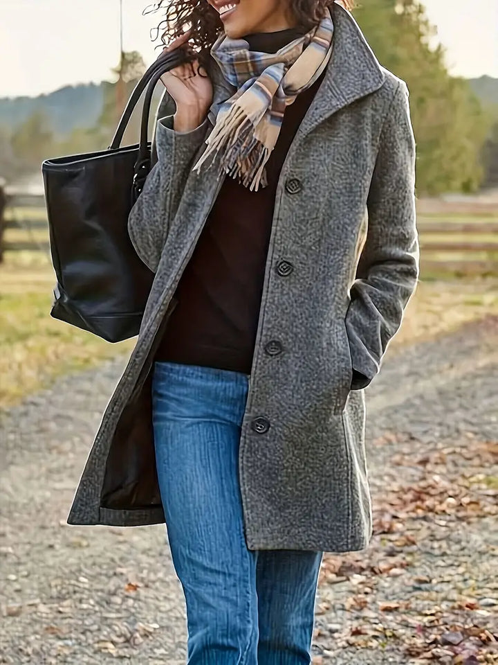 Stylish women's mid-length trench coat with lapels & buttons. Versatile outerwear for fall fashion.