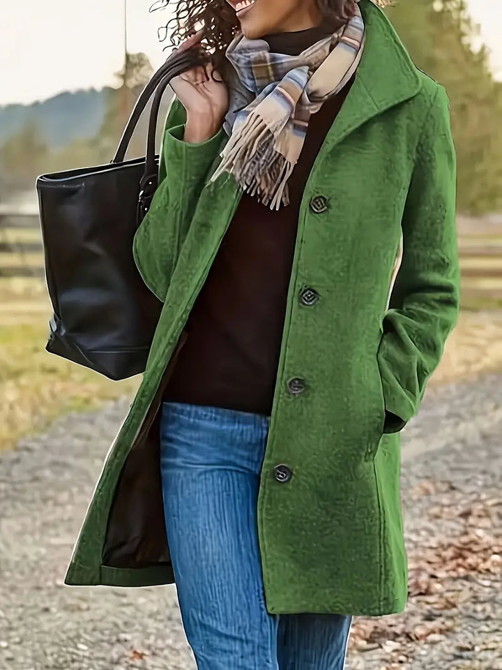 Chic women's outerwear trenchcoat featuring a timeless lapel and button-front closure. Classic style.