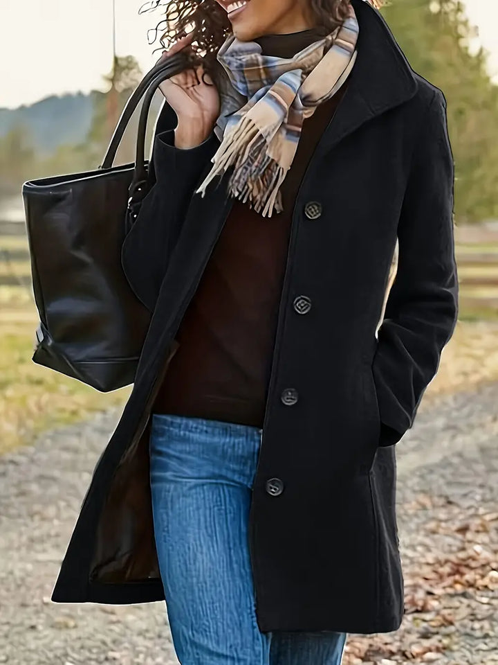 Versatile women's mid-length trench coat. Elegant button-front, lapel design. Essential fall/winter outerwear.