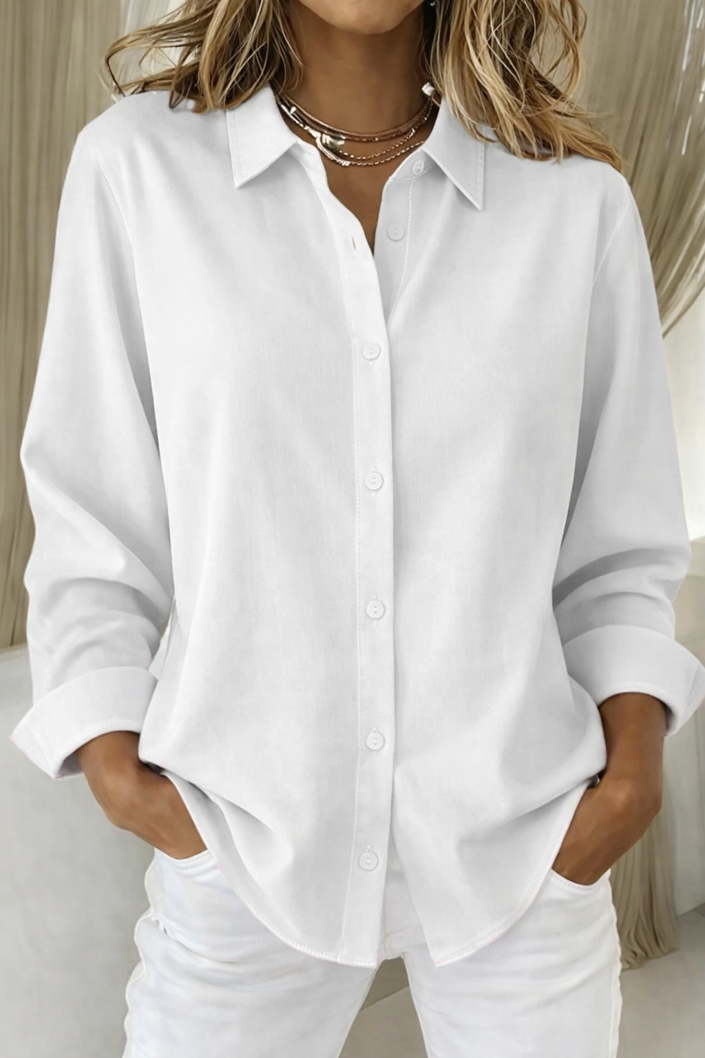 Solid color long sleeve button-up women's blouse, a versatile top for everyday and classic looks.