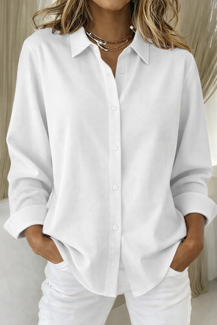 Solid color long sleeve button-up women's blouse, a versatile top for everyday and classic looks.