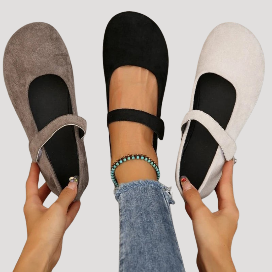 Elegant black Mary Jane flats for women with a functional buckle strap. Comfortable classic style for any occasion.