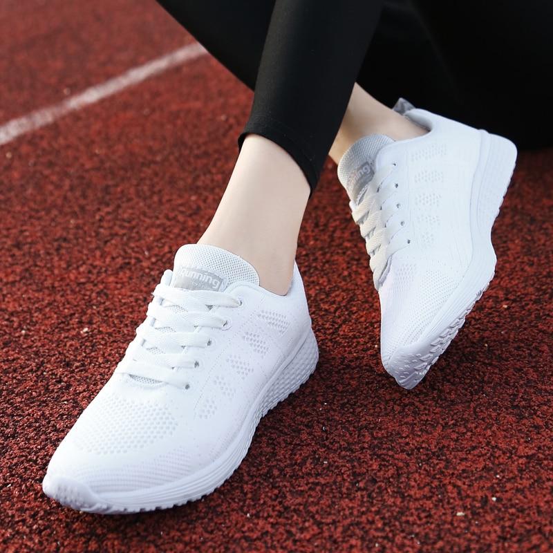 Lace-up women's walking shoes, orthopedic design, ideal for active wear and foot support.