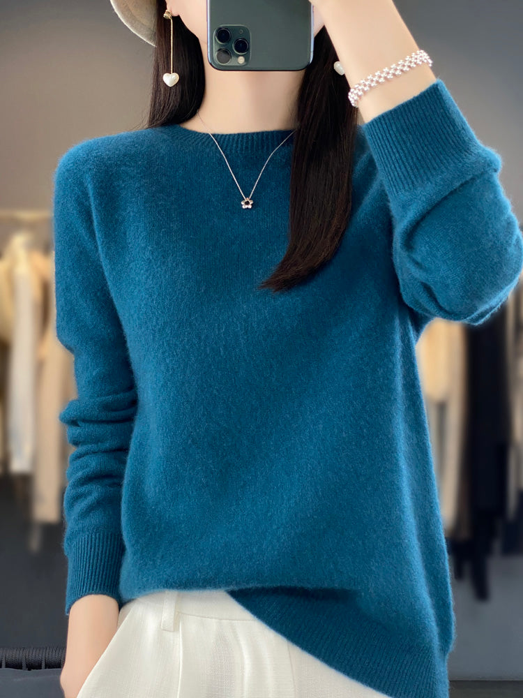 Soft knit women's round neck pullover sweater, long sleeve, perfect for winter casual chic.