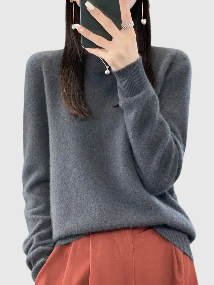 Stylish women's round neck pullover sweater, cozy knit, long sleeve, great for winter comfort.