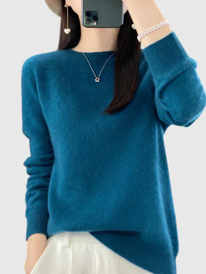 Soft knit women's round neck pullover sweater, long sleeve, ideal for comfy everyday winter wear.
