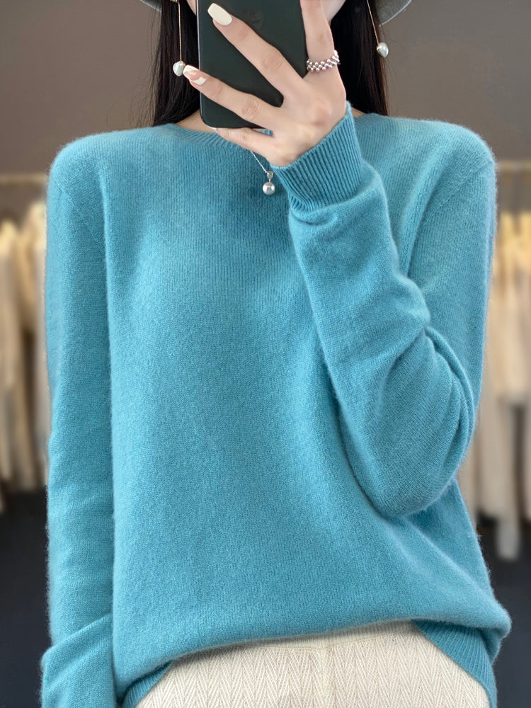 Cozy knit women's round neck pullover sweater, long sleeve, ideal for comfortable winter wear.