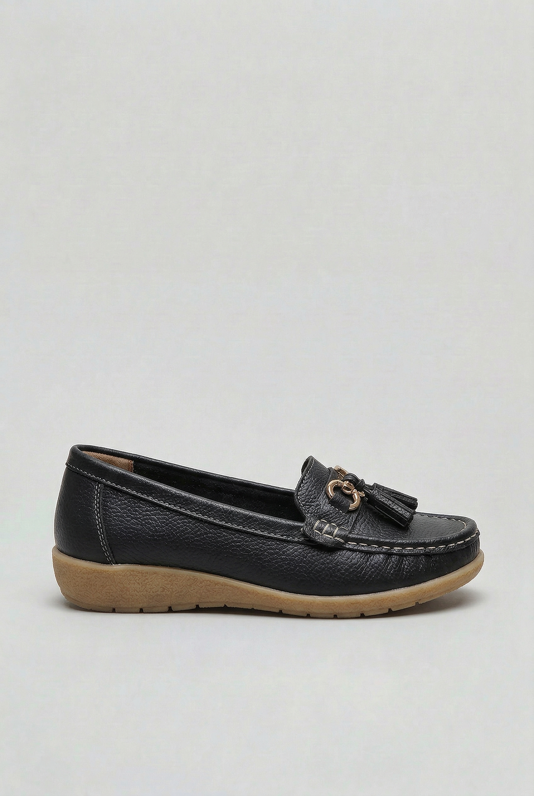 Everyday women's footwear: classic slip-on loafers with cushioned comfort for versatile styling.