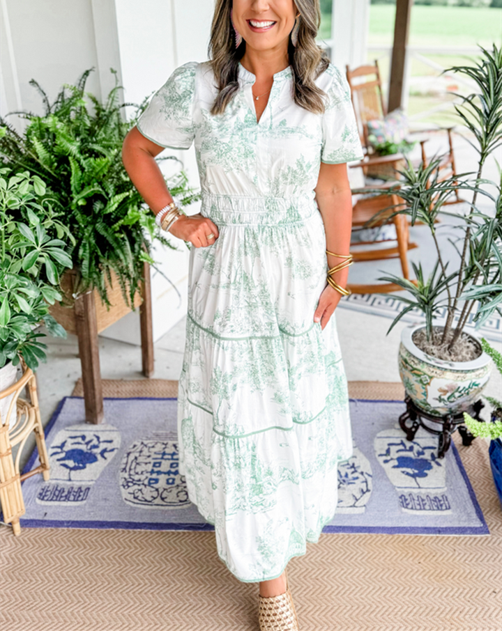 Classic Toile print women's long dress, featuring a smocked waist and tiered skirt for spring elegance.