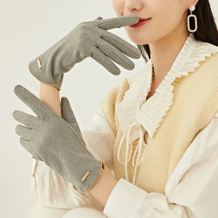 Classic women's warm winter gloves with touchscreen capability for easy device interaction.
