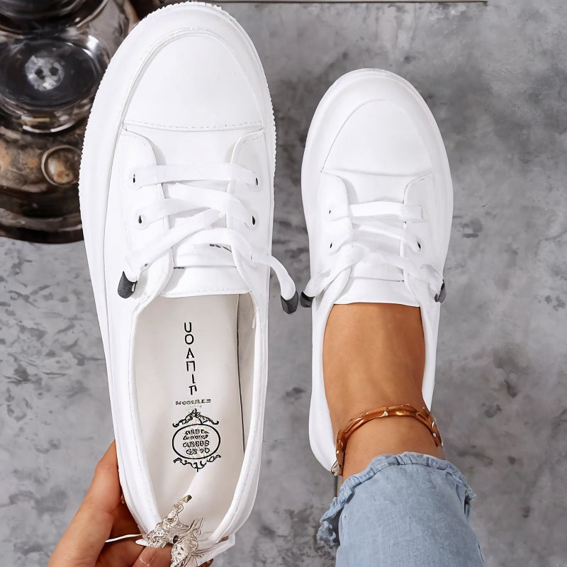 Versatile women's black classic lace-up flatform sneakers. Perfect comfortable casual everyday court shoes.