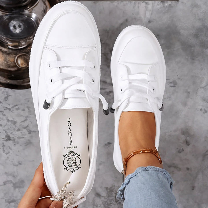 Versatile women's black classic lace-up flatform sneakers. Perfect comfortable casual everyday court shoes.