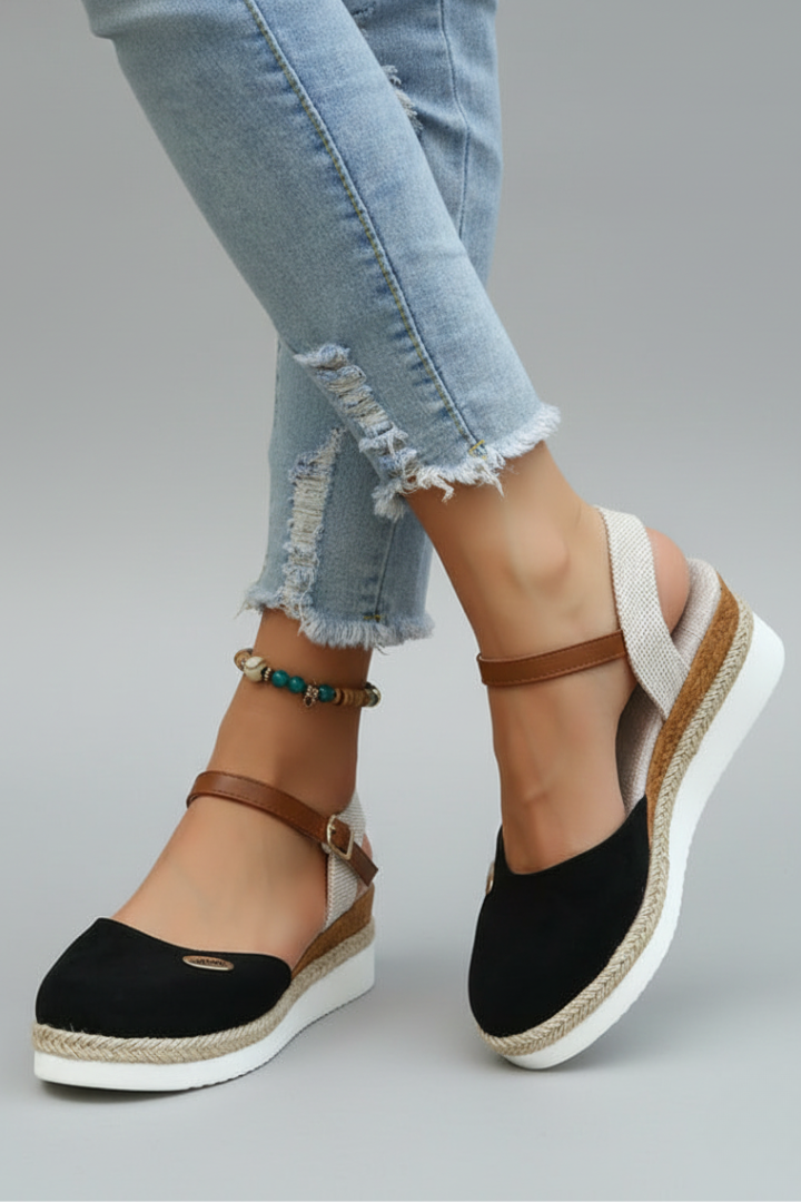Chic women's closed-toe espadrille sandals with a supportive heel strap & comfortable platform for summer fashion.