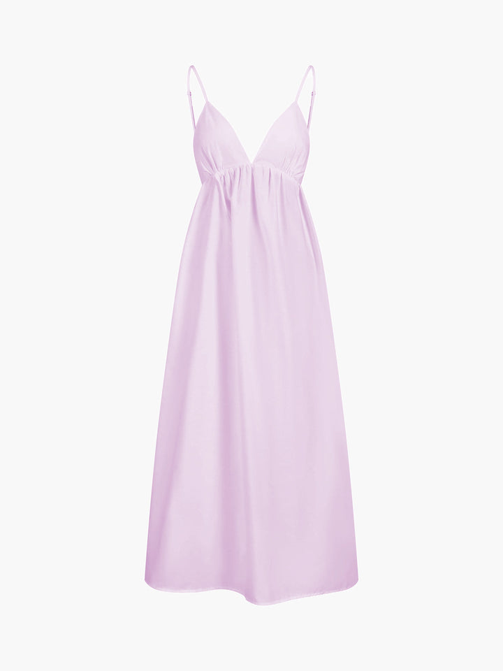 Women's Coastal Cowgirl maxi dress featuring a chic open back. Flowy and sleeveless, perfect for summer beach style.