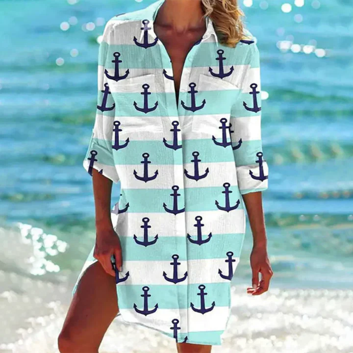 Elegant women's button-up mini dress featuring a crisp collar, perfect for a casual yet refined look.