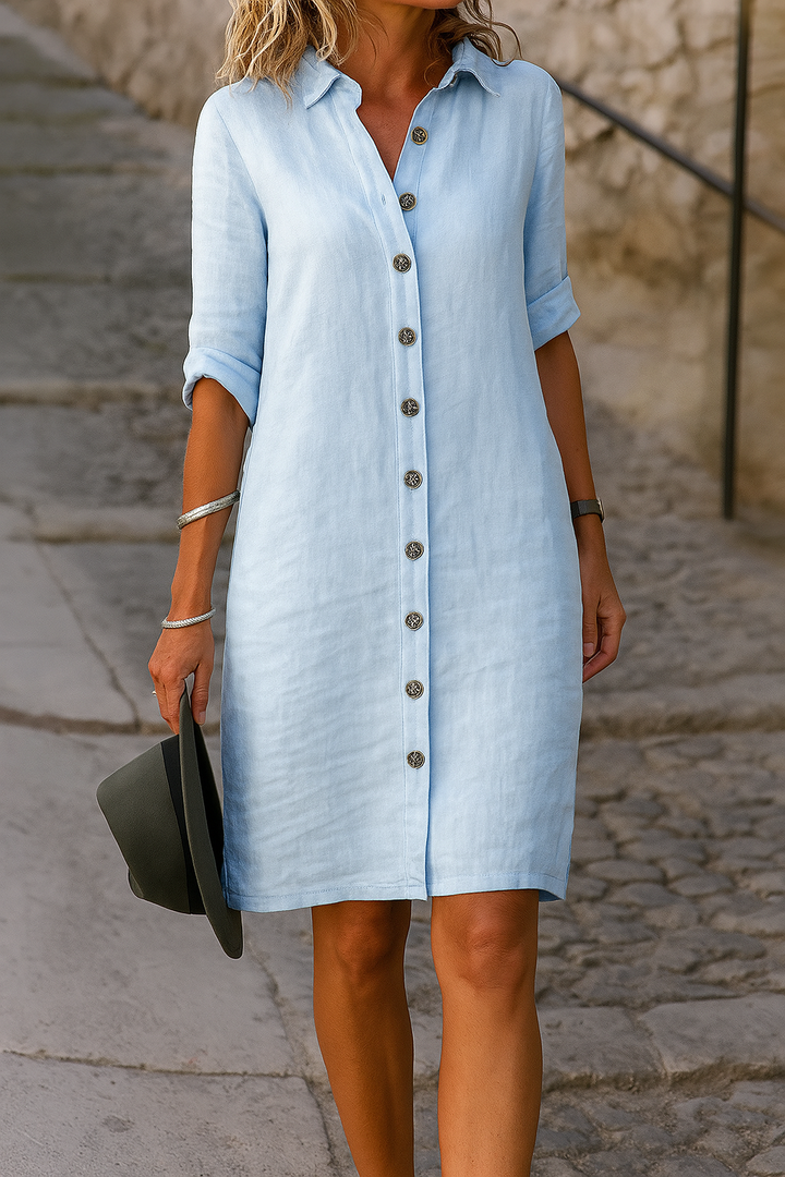 Women's vacation shirt dress, collared, button front, roll-tab sleeves, relaxed fit for warm days.
