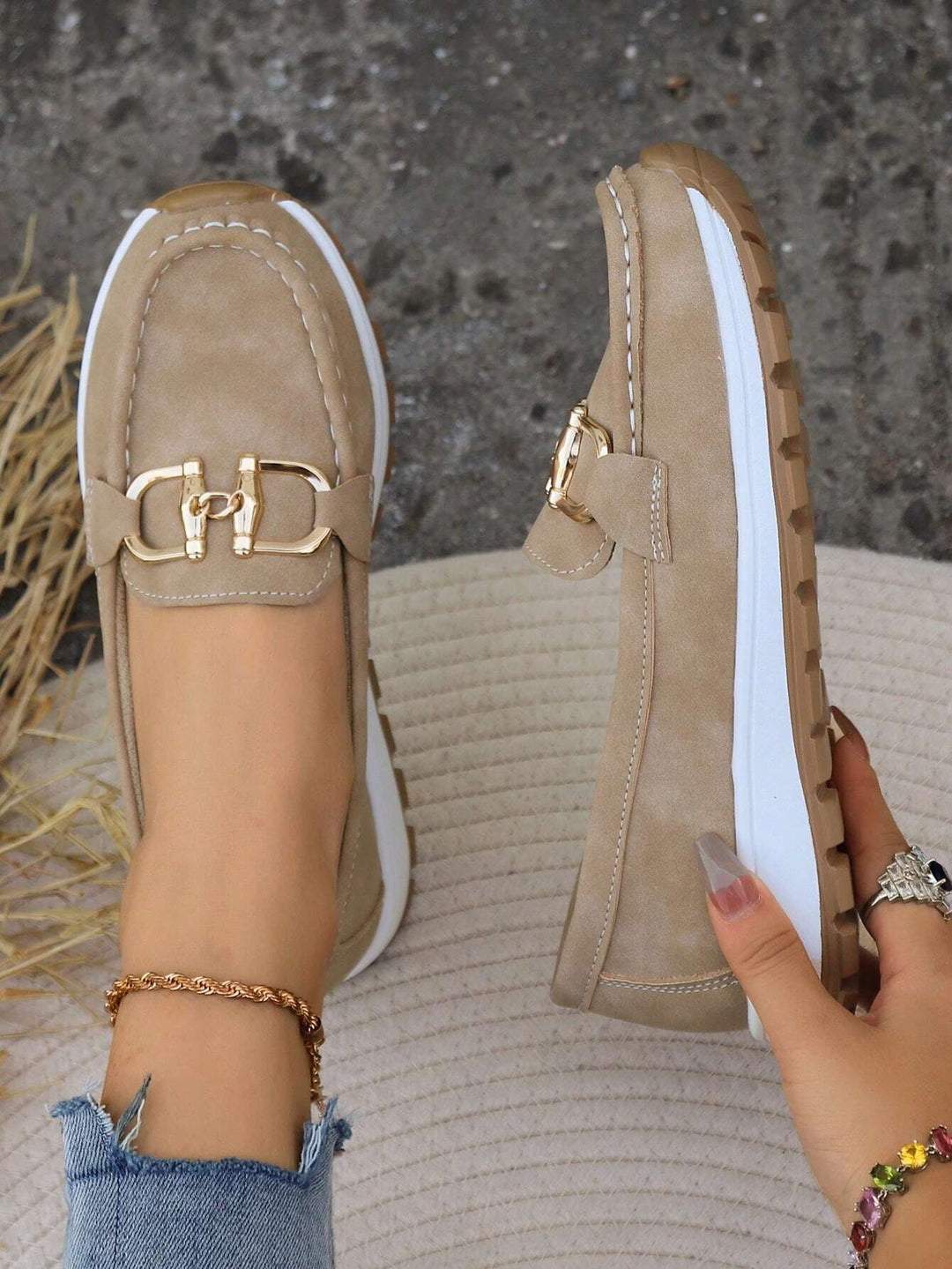 Classic women's loafers with a prominent gold buckle, combining comfort & everyday versatility.