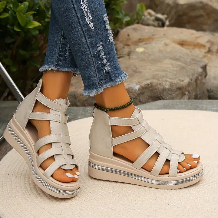Stylish women's flat sandals with glamorous rhinestones, ideal for warm weather.
