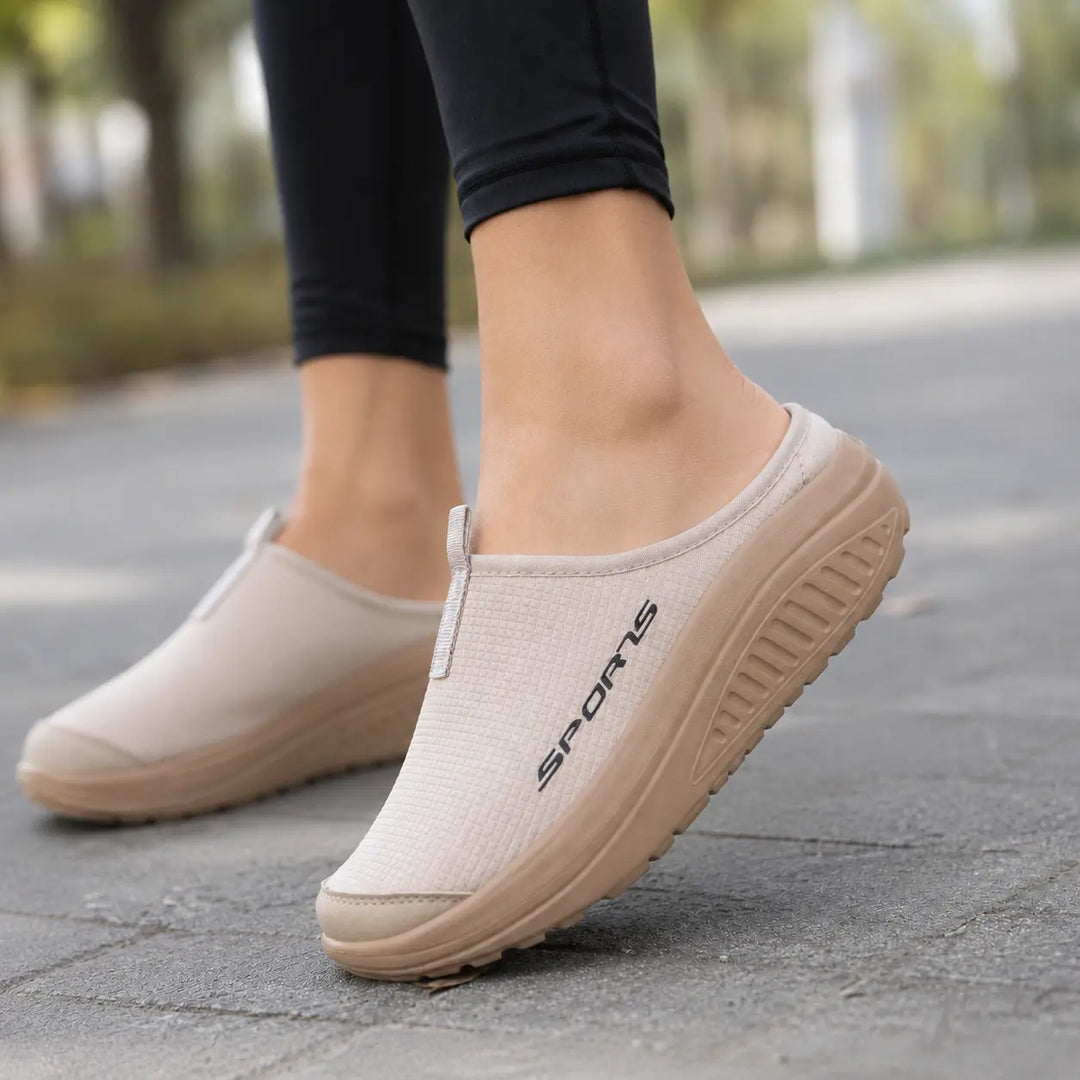 Women's comfortable slip-on orthopedic slippers, closed-toe design for indoor support & relief.