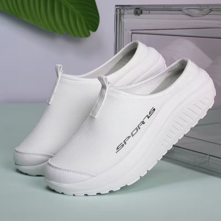 Orthopedic slip-on women's slippers, closed-toe, featuring cushioning for all-day indoor comfort.