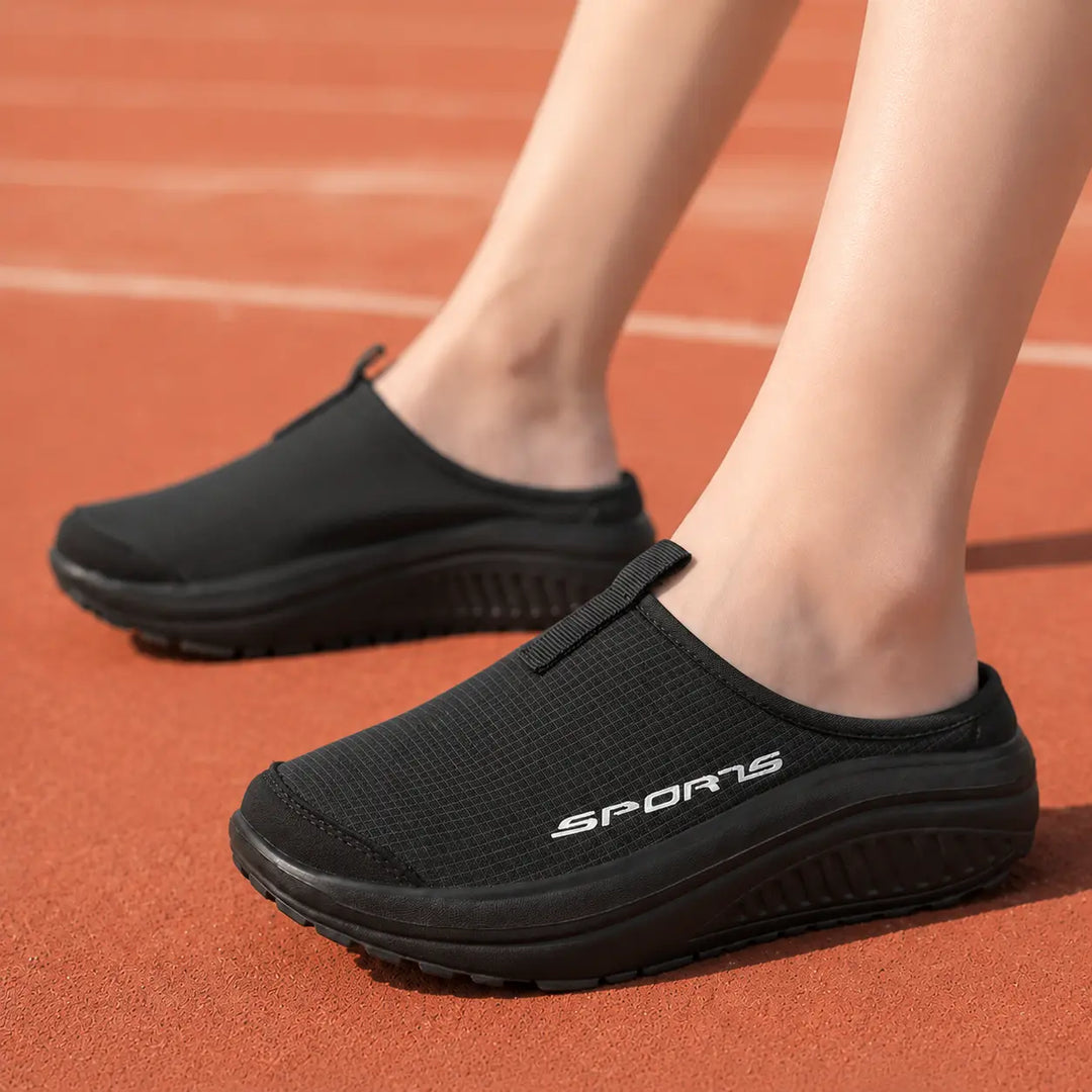 Women's comfort slip-on slippers with closed toe, orthopedic design for supportive home footwear.