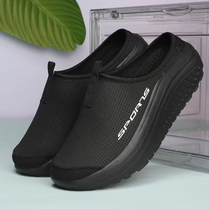 Cushioned women's closed-toe orthopedic slippers, slip-on style for easy, comfortable indoor wear.