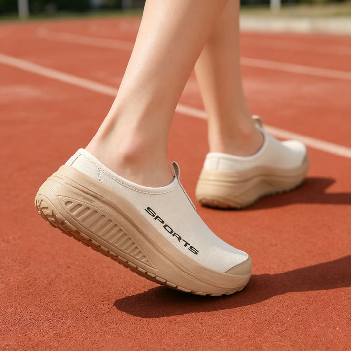 Women's orthopedic slip-on slippers with a closed toe, providing cushioned and supportive comfort.