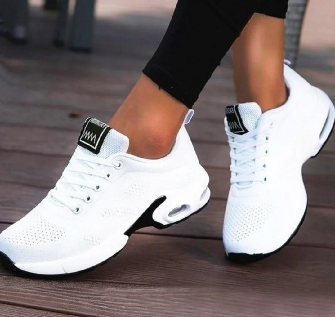 Sporty women's athletic sneakers with air cushioning for ultimate comfort, orthopedic support, and lightweight feel.