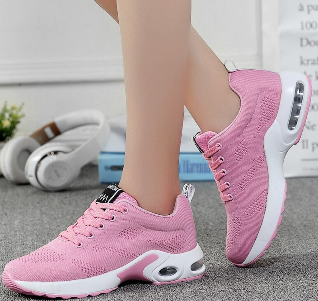Lightweight women's running shoes with air cushion technology & breathable design for active wear & fitness.