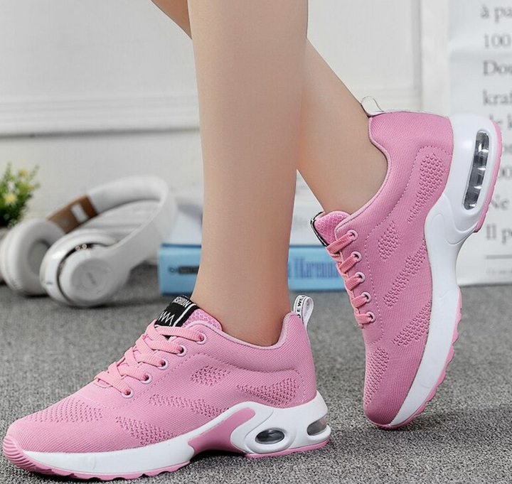 Lightweight women's running shoes with air cushion technology & breathable design for active wear & fitness.