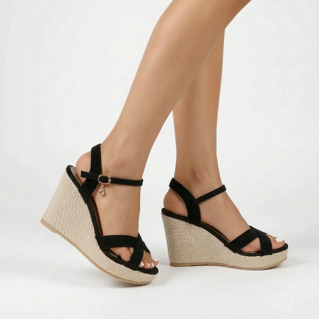 Fashionable women's wedge sandals: comfortable platform design, criss-cross strap, perfect black summer heels.