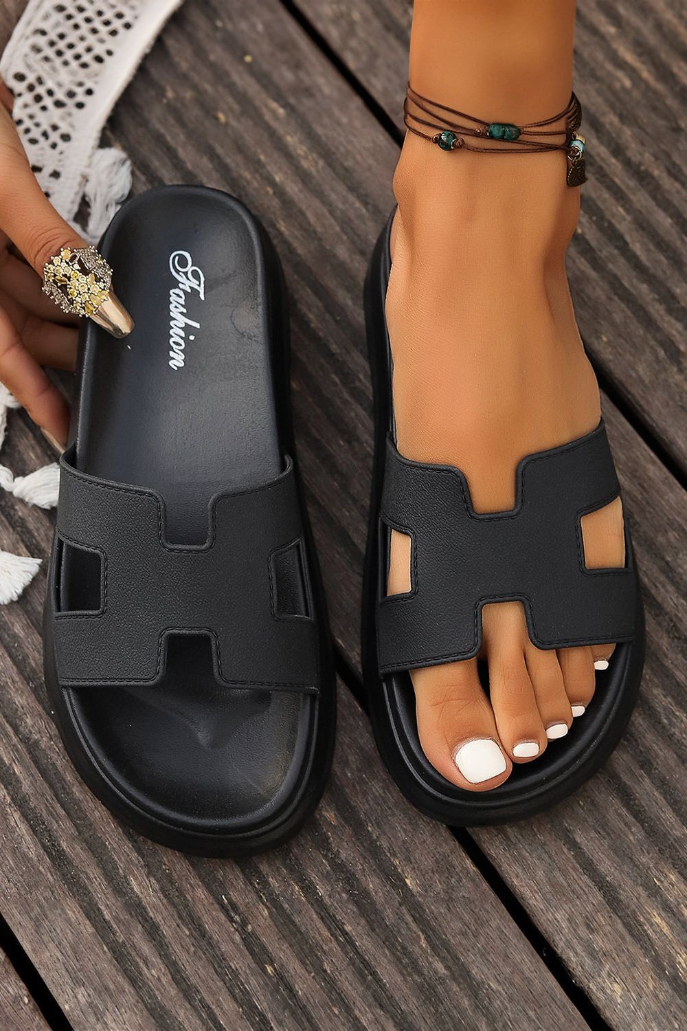 Stylish women's open-toe slip-on sandals with cushioned sole for summer.