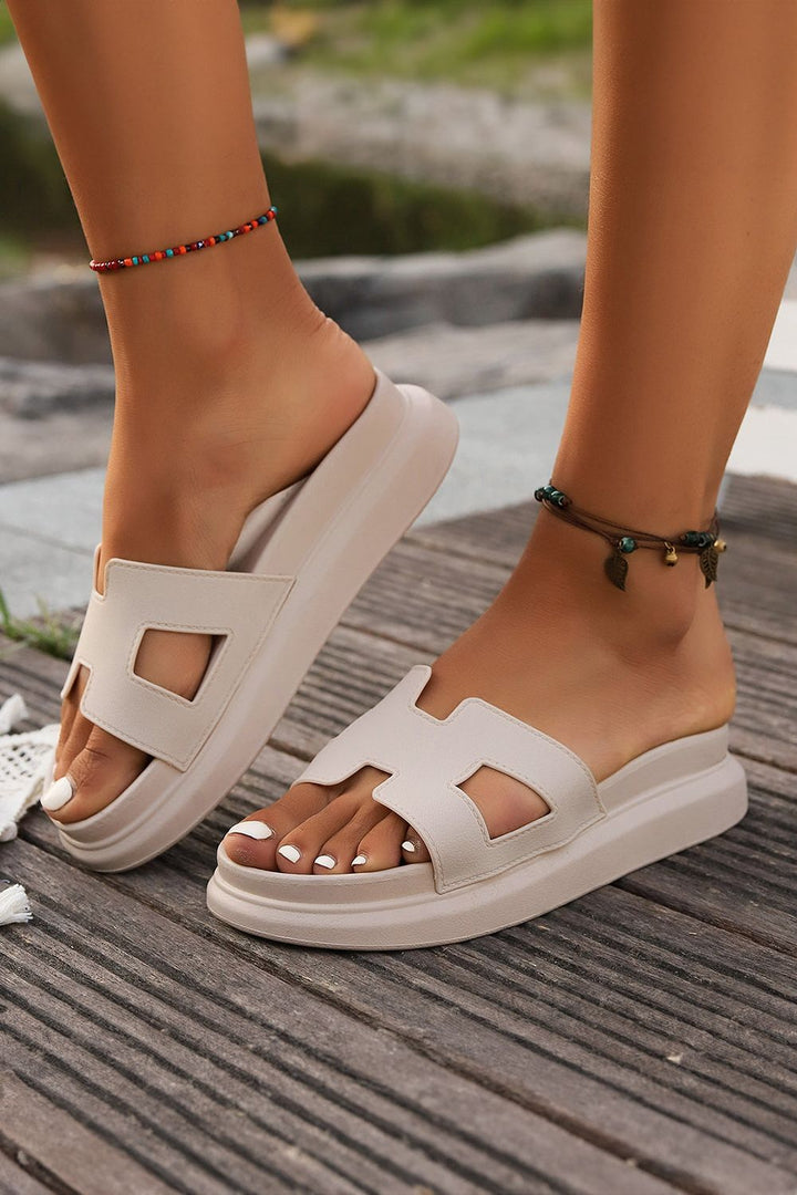 Close-up of comfortable women's strappy sandals, featuring open-toe design.