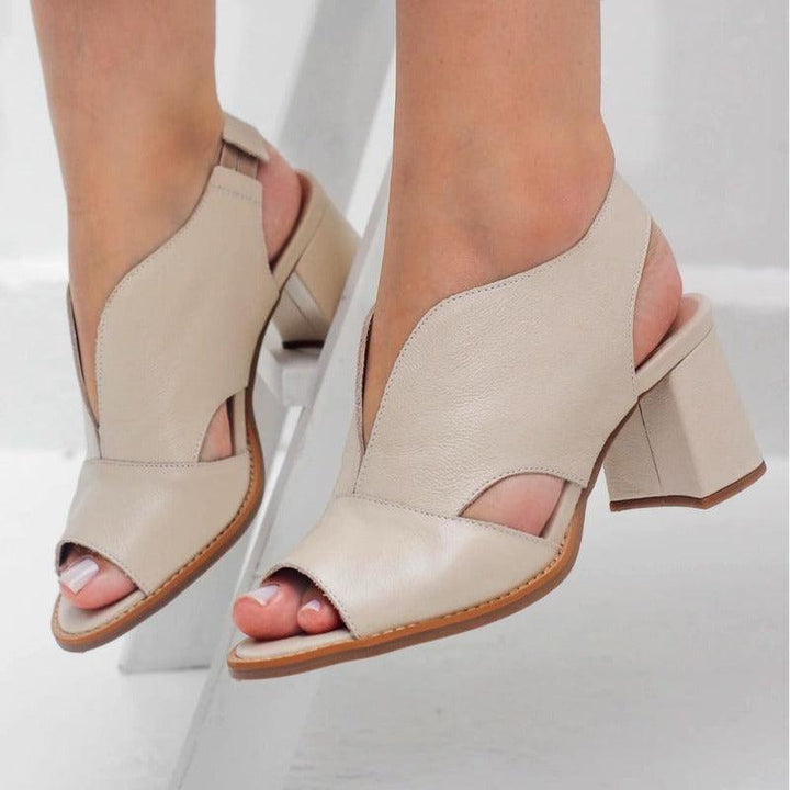 Women's comfortable ankle strap block heel sandals, essential summer footwear.