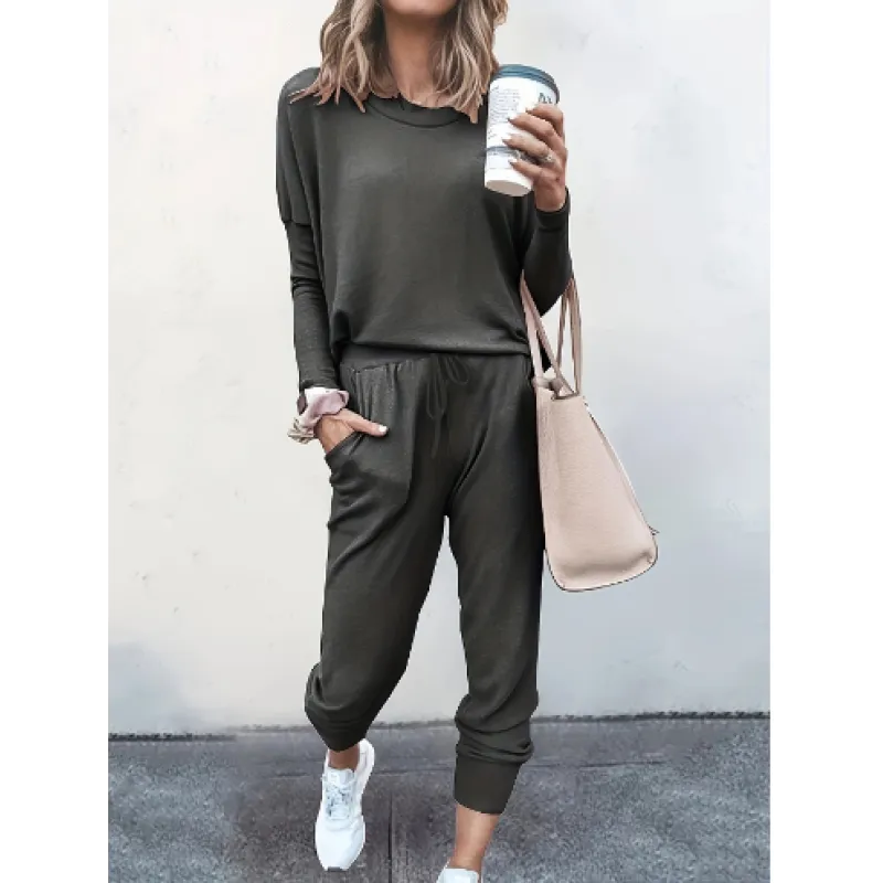 Women's comfortable crew neck jogger set. Stylish two-piece loungewear with long sleeve top and tapered pants.