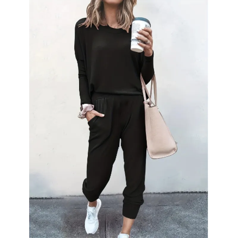 Woman wearing a cozy gray crew neck jogger set, perfect for loungewear or a casual outfit.