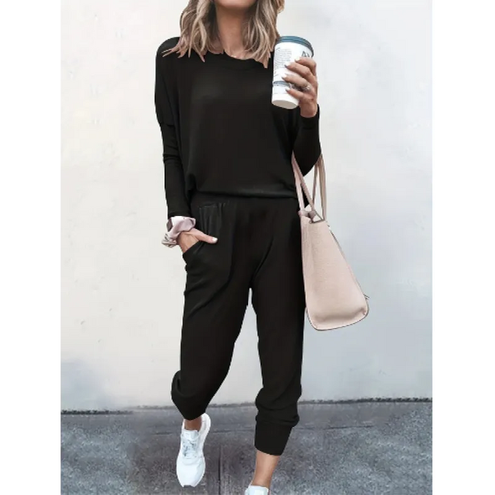 Woman wearing a cozy gray crew neck jogger set, perfect for loungewear or a casual outfit.