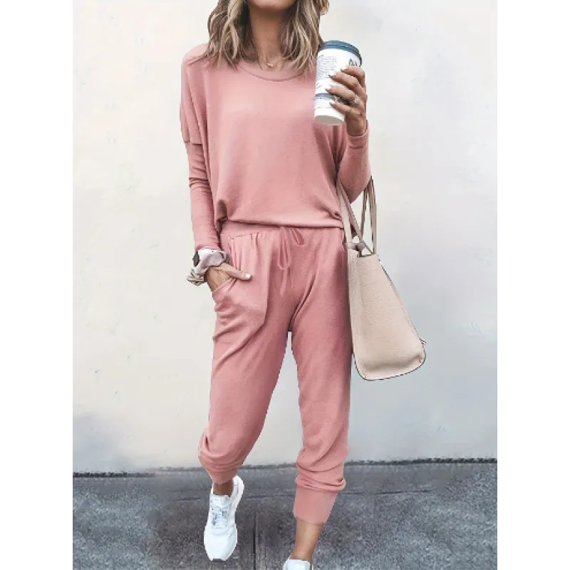 Women's long sleeve crew neck top and tapered jogger pants, a comfortable two-piece matching set.