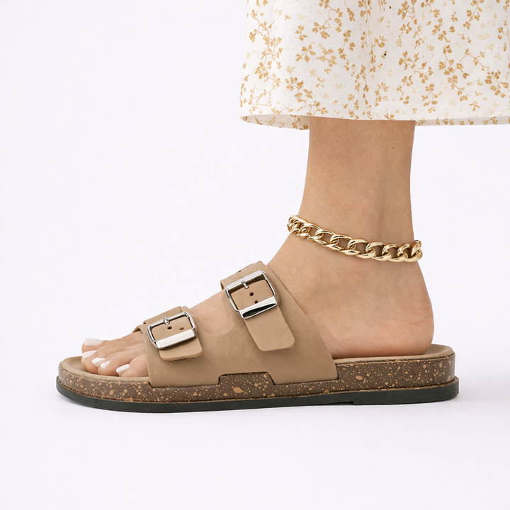 Supportive women's flat walking sandals with adjustable double straps for all-day comfort.
