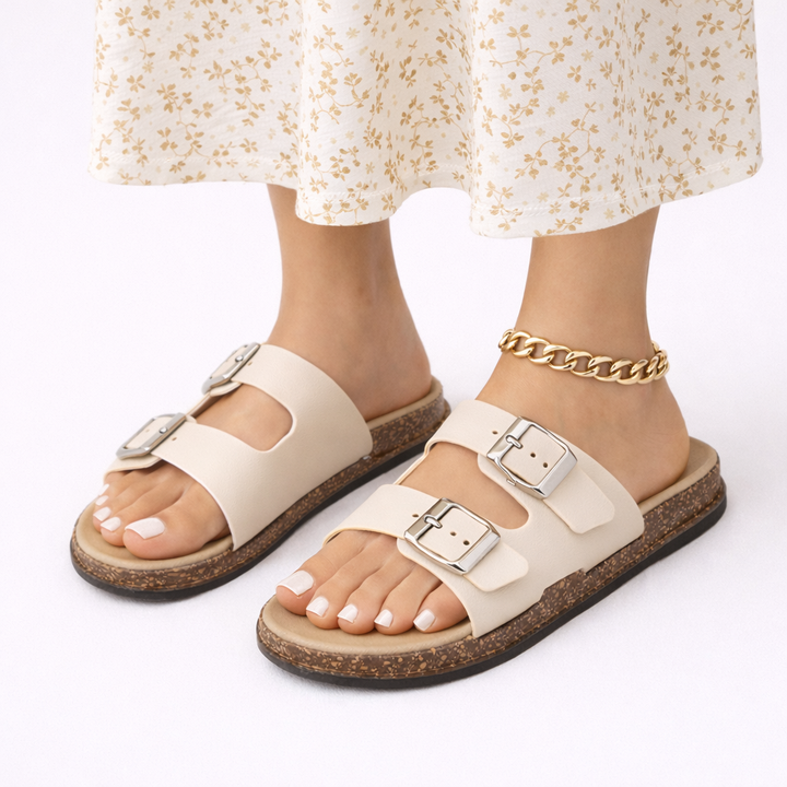 Comfortable women's flat sandals with adjustable double straps, ideal for walking & summer activities.