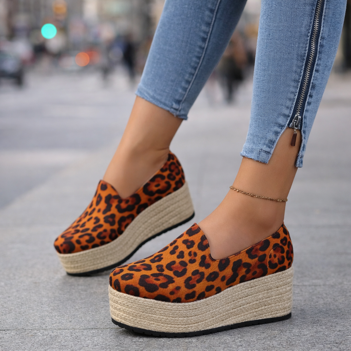 Fashionable women's platform slip-on shoes with espadrille detailing, ideal for summer.