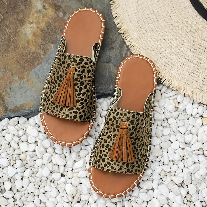 Women's casual slip-on flat sandals, comfortable open-toe design for stylish summer & vacation wear.