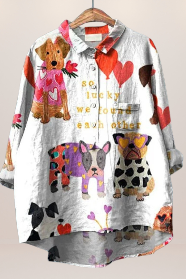 Patterned women's blouse with a vibrant floral print. Comfortable, relaxed fit top for effortless, casual style.