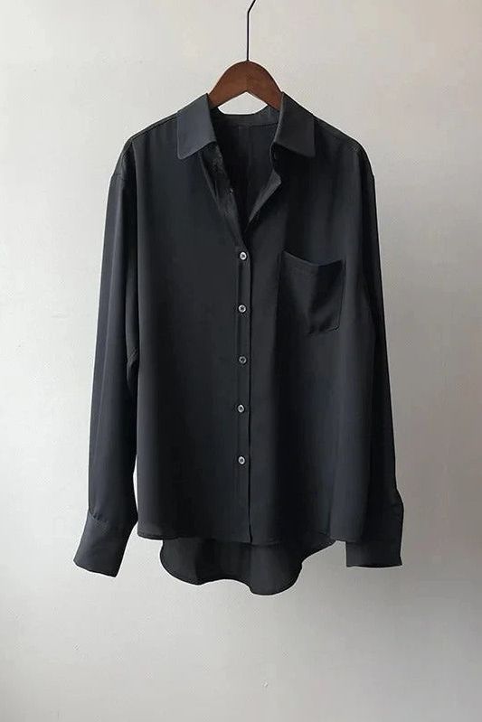 Elegant white women's flowy top. Comfortable relaxed fit blouse, great for versatile everyday styling.